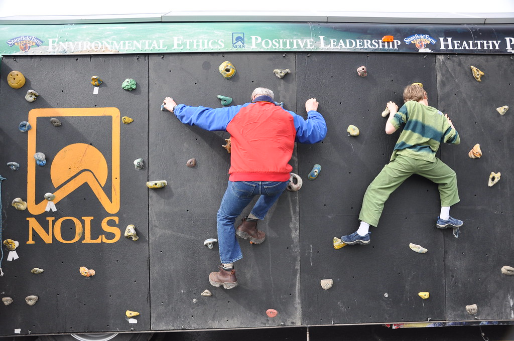 NOLS grad and son climb the wall NOLS grad and son climb the wall