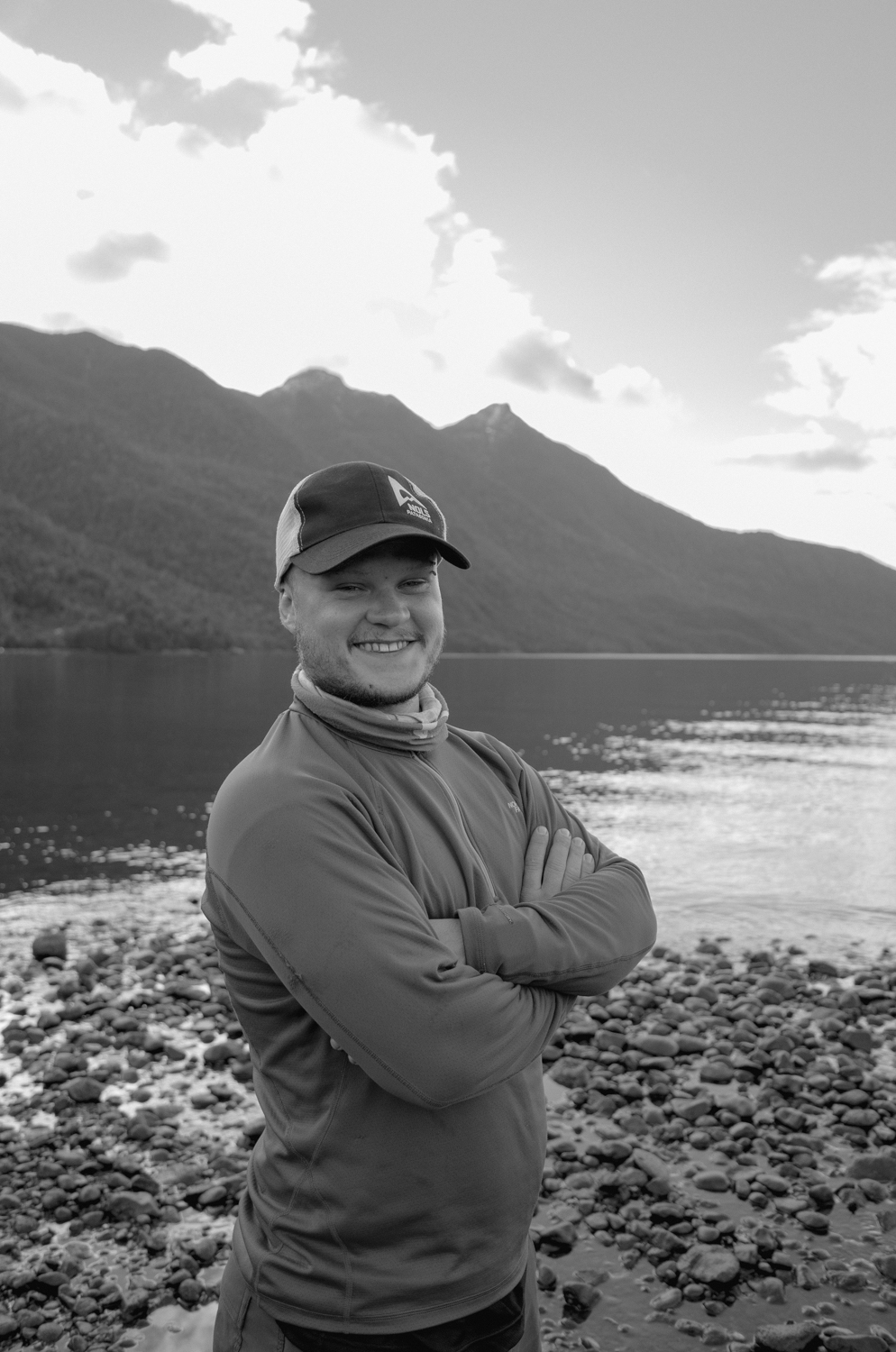 Person smiling in front of ariver