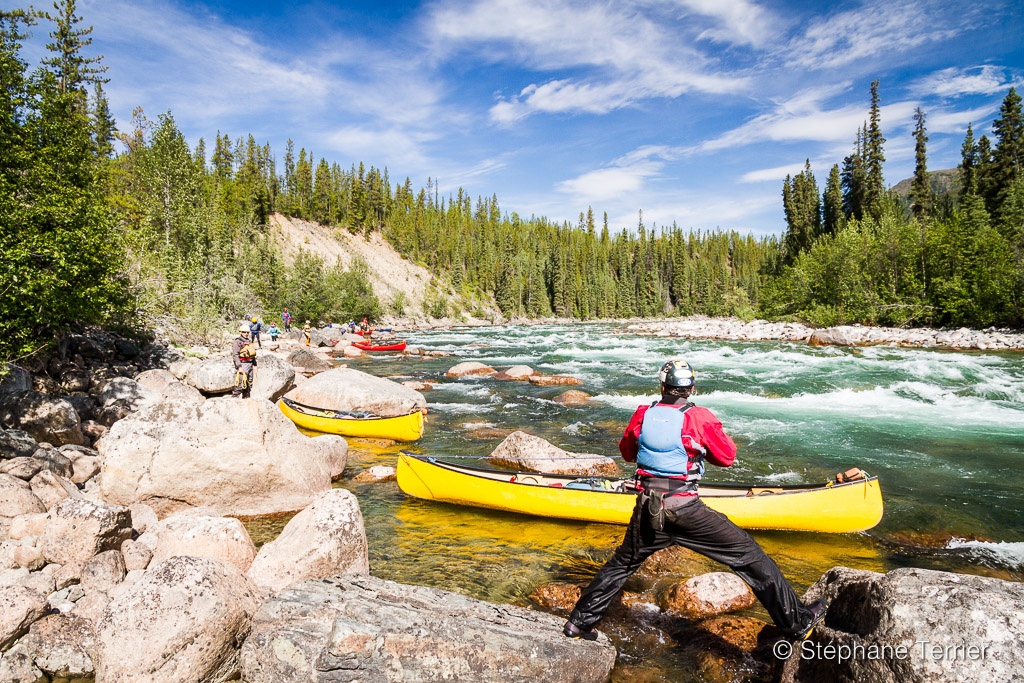 Lining a rapid of the Nisutlin River