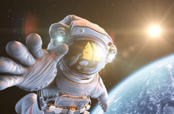 NASA astronaut in space, earth and sun in background NASA astronaut in space, earth and sun in background
