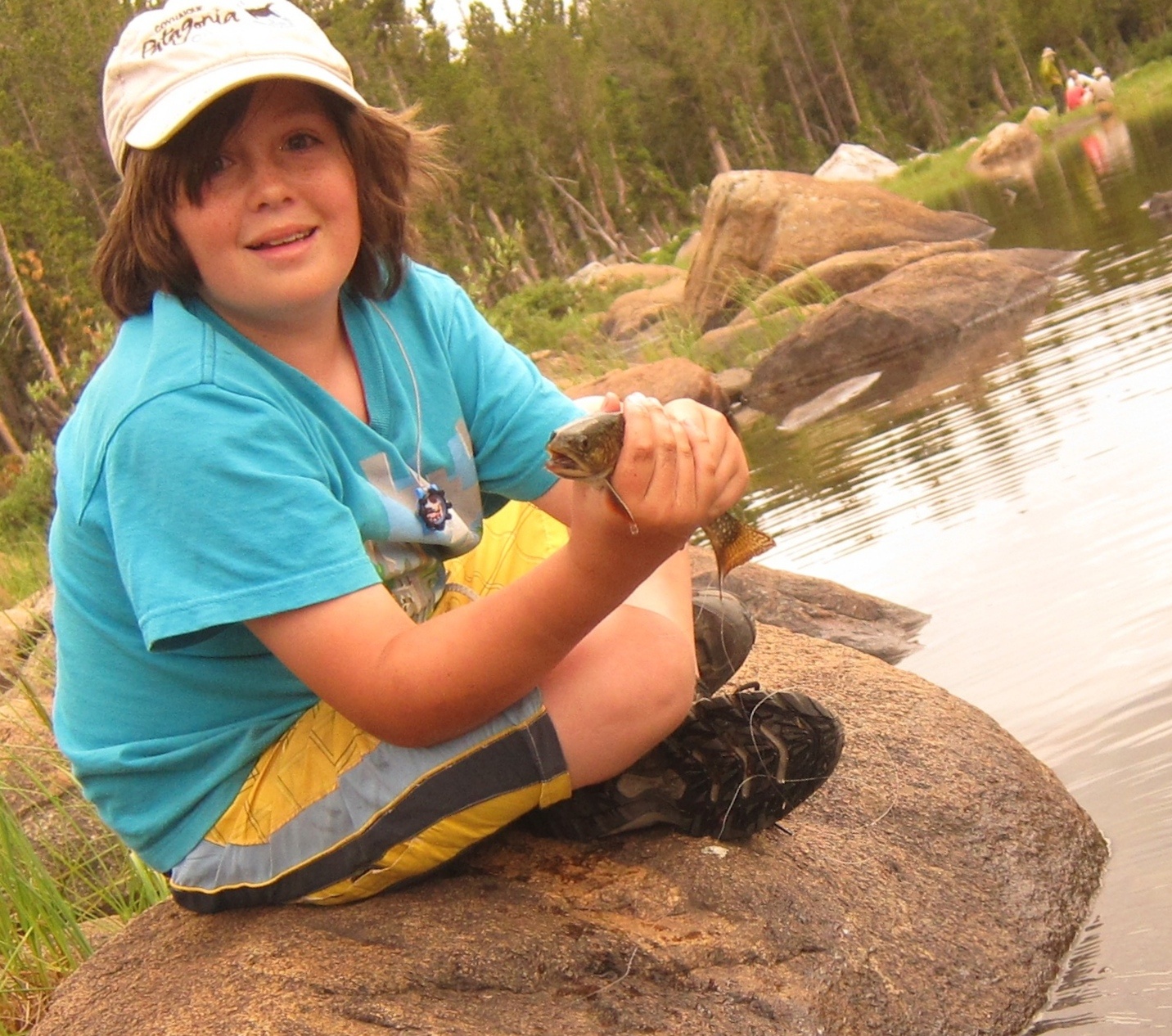 Judd's son holding a fish