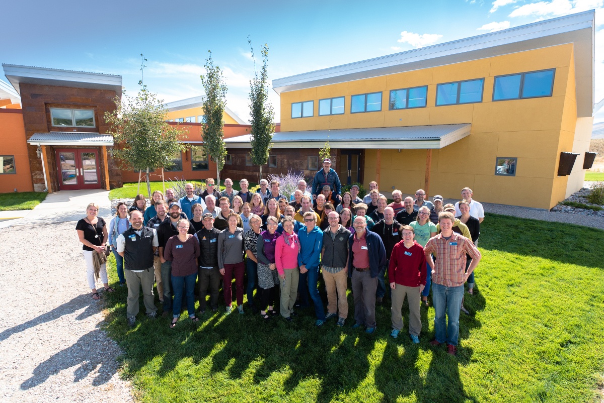 wyss-campus-wilderness-medicine-staff-meeting Attendees stand outside the Wyss Campus buildings
